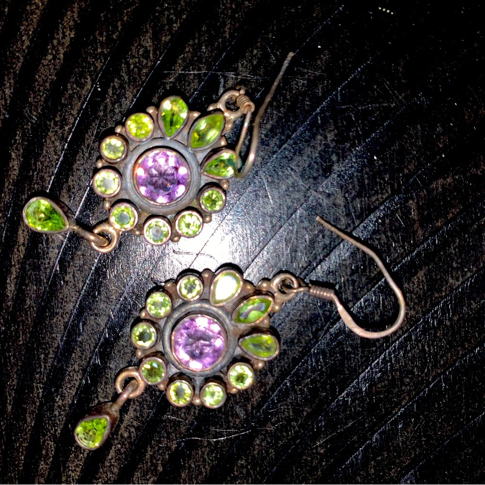 Silver earrings, purple and green gemstones.